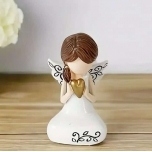 Ingel kuldse südame ja tumeda patsiga